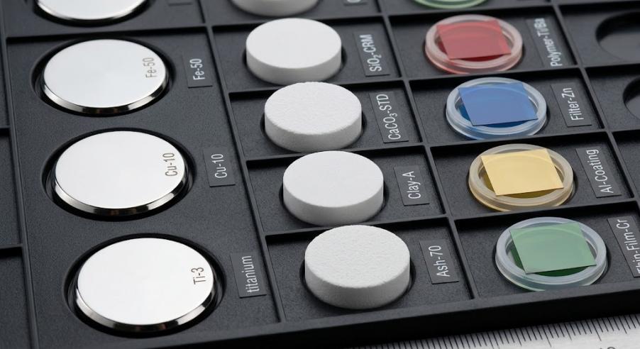 Various types of xrf standards in a reference sample tray